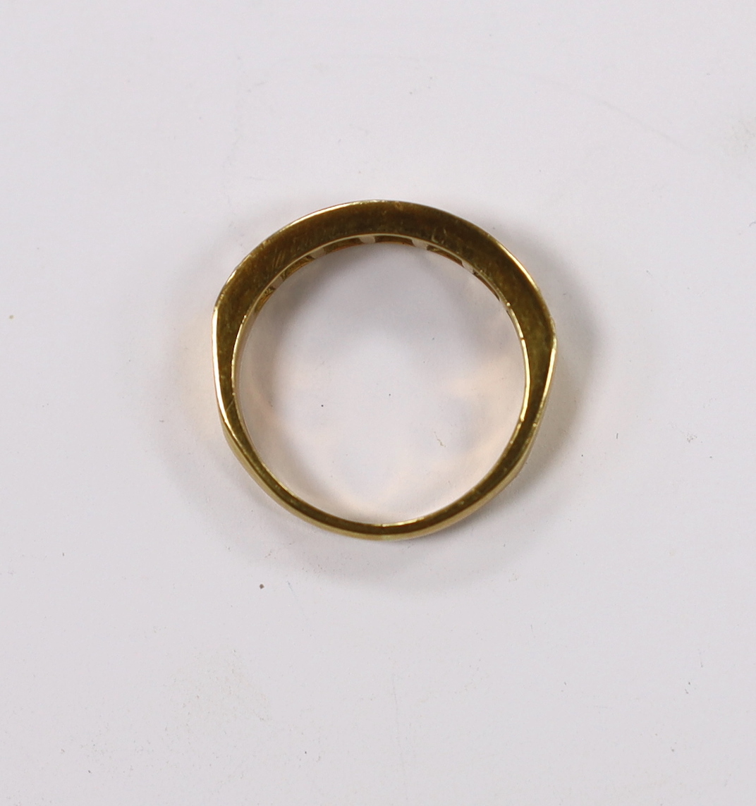 A modern 18ct gold and seven stone diamond set half hoop ring, size L, gross weight 4.3 grams.